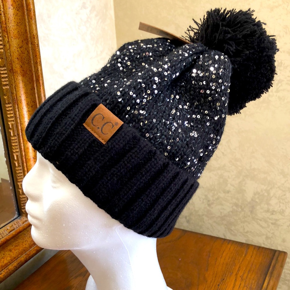 New Women’s black hat with sequins and pompon.  Turn up edge.  Fuzzy inside.